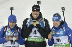 Winner Emil Hegle Svendsen of Norway, center, second placed Evgeny Ustyugov of Russia, left, third placed Lukas Hofer of Italy, right, pose with their medals after the men's 15 km mass start at the IBU World Championships Biathlon at Khanty-Mansiysk, 2759 km North-East of Moscow, Russia, Saturday, March 12, 2011.