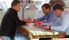 Russian President Dmitry Medvedev, second right, Russian gas monopoly Gazprom Head Alexei Miller, left, and Deputy Prime Minister Dmitry Kozak, right, who is overseeing Sochi preparations, talk while visiting a construction site of a skiing and biathlon facility for the 2014 Sochi Winter Olympics, near the Black Sea resort of Sochi, southern Russia, Tuesday, Aug. 23, 2011.