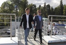 Russian President Dmitry Medvedev, right, accompanied by Russian gas monopoly Gazprom Head Alexei Miller, visits a construction site of a skiing and biathlon facility for the 2014 Sochi Winter Olympics, near the Black Sea resort of Sochi, southern Russia, Tuesday, Aug. 23, 2011.
