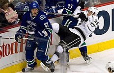 Vancouver Canucks' Dale Weise, Left, Upends