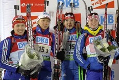 Russian team (L-R) Olga Medvedtseva, Olga Zaitseva, Anna Boulygina and Svetlana Sleptsova smile after finishing second in the the women's 4x6 km relay at the Biathlon World Cup in Ostersund December 6, 2009. Germany won the relay, Russia finished second and France third.