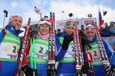 HOCHFILZEN, AUSTRIA - DECEMBER 13: (l-r) Iana Romanova, Anna Boulygina, Olga Zaitseva and Svetlana Sleptsova of Russia won the women's 4x6km relay on December 13, 2009 in Hochfilzen, Austria.
