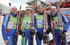 Winners Iana Romanova, from left, Anna Boulygina, Olga Zaitseva and Svetlana Sleptsova from Russia celebrate after the women's 4x6 kilometers relay race at the Biathlon World Cup competition in Hochfilzen, Austrian province of Tyrol, on Sunday, Dec. 13, 2009.