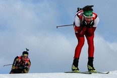 HOCHFILZEN, AUSTRIA - DECEMBER 13: Simon Eder of Austria competes infront of Christoph Stephan of Germany during the Men's 4x7, 5 km Relay in the IBU Biathlon World Cup on December 13, 2009 in Hochfilzen, Austria.